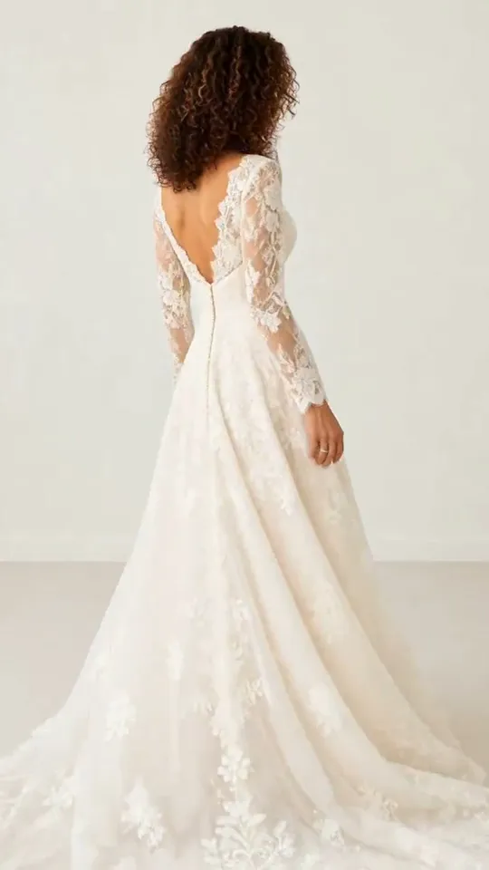 A wedding dress from your clothing photo, shown as a full-length bridal portrait with the skirt spread out.