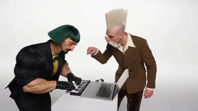 An AI-made muscular man with green hair plays a small keyboard in a white studio while a man with a towering white quiff and a huge moustache leans over and points at the screen