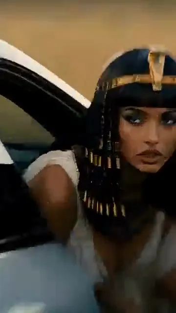 An AI-made Egyptian queen leans out of the open door of a silver sports car and stares into the camera