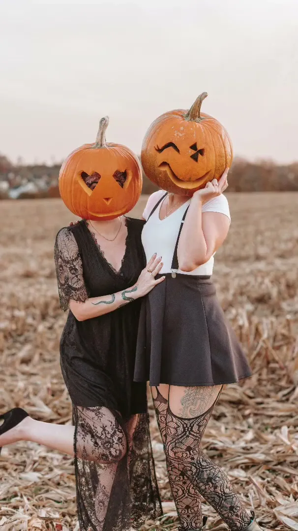 A smooth painted smiling pumpkin head in golden autumn light designed for a pumpkin head photoshoot for kids.