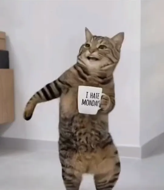 The same AI tabby cat swings one front paw out and leans to one side while the mug stays against its chest and a grin starts to break