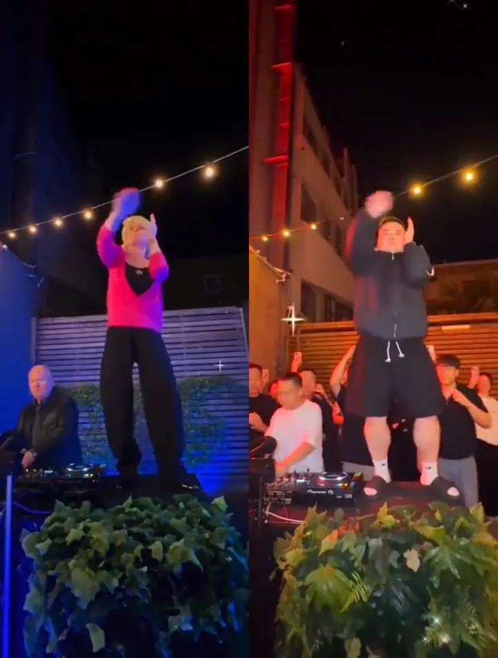 A split screen: a dancer in a pink top on a blue-lit stage on the left and a dancer in a black hoodie on a red-lit stage on the right